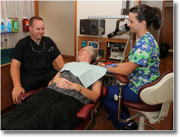 Dr. Wiles and a hygienist get acquainted with a new patient